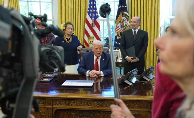 President Donald Trump speaks as he signs executive orders in the Oval Office of the White House, Thursday, April 17, 2025, in Washington. (AP Photo/Alex Brandon)