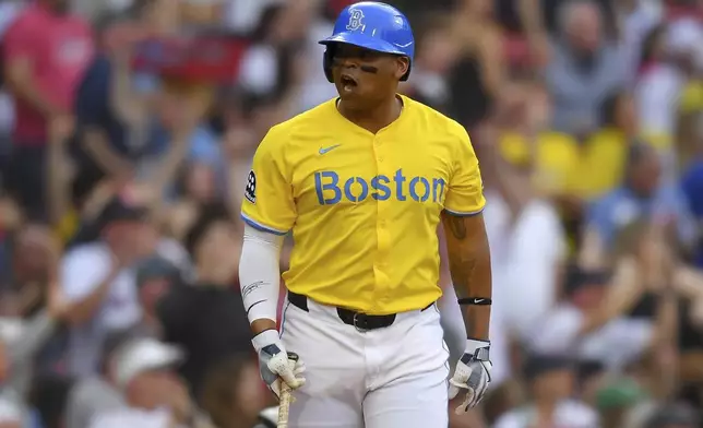 Boston Red Sox's Rafael Devers celebrates as he begins to run the bases after hitting a three-run home run in the fifth inning of a baseball game against the Chicago White Sox, Saturday, April 19, 2025, in Boston. (AP Photo/Steven Senne)