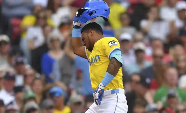 Boston Red Sox's Ceddanne Rafaela reacts after he is hit by a pitch in the second inning of a baseball game against the Chicago White Sox, Saturday, April 19, 2025, in Boston. (AP Photo/Steven Senne)