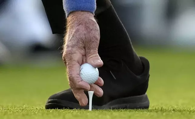 Honorary Starter Jack Nicklaus places his ball on the tee on the first hole during the first round at the Masters golf tournament, Thursday, April 10, 2025, in Augusta, Ga. (AP Photo/David J. Phillip)