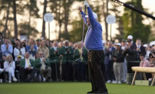 Honorary Starter Jack Nicklaus acknowledges the patrons after his shot on the first hole during the first round at the Masters golf tournament, Thursday, April 10, 2025, in Augusta, Ga. (AP Photo/Matt Slocum)