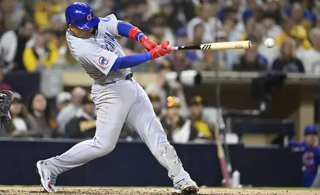Chicago Cubs' Miguel Amaya hits a single during the sixth inning of a baseball game against the San Diego Padres, Monday, April 14, 2025, in San Diego, Calif. (AP Photo/Denis Poroy)