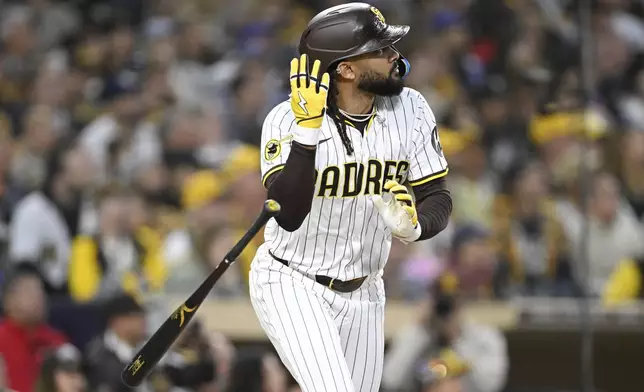 San Diego Padres' Fernando Tatis Jr. watches his solo home run during the third inning of a baseball game against the Chicago Cubs, Monday, April 14, 2025, in San Diego, Calif. (AP Photo/Denis Poroy)