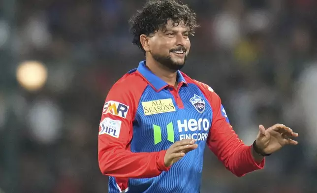 Delhi Capitals' Kuldeep Yadav celebrates the dismissal of Royal Challengers Bengaluru's captain Rajat Patidar during the Indian Premier League cricket match between Royal Challengers Bengaluru and Delhi Capitals at Chinnaswamy Stadium in Bengaluru, India, Thursday, April 10, 2025. (AP Photo/Aijaz Rahi)