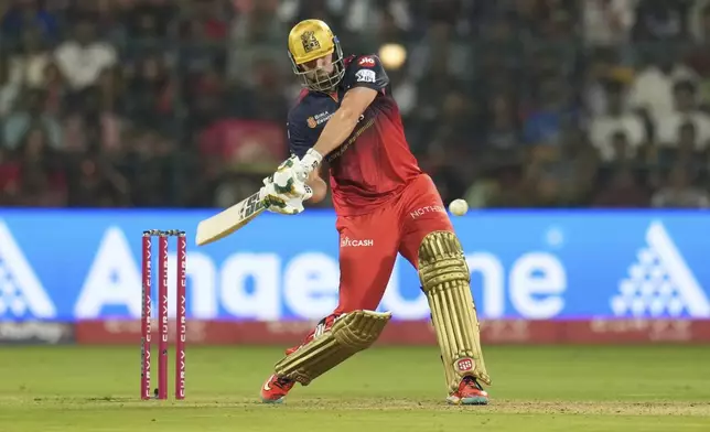 Royal Challengers Bengaluru's Tim David plays a shot during the Indian Premier League cricket match between Royal Challengers Bengaluru and Delhi Capitals at Chinnaswamy Stadium in Bengaluru, India, Thursday, April 10, 2025. (AP Photo/Aijaz Rahi)