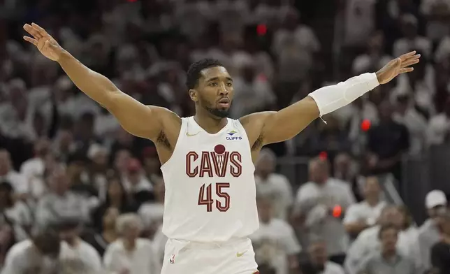 Cleveland Cavaliers guard Donovan Mitchell (45) gestures in the second half in Game 2 of an NBA first-round playoff series against the Miami Heat, Wednesday, April 23, 2025, in Cleveland. (AP Photo/Sue Ogrocki)