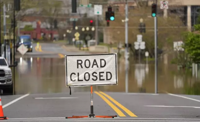 A street is closed off due to flood waters in Hopkinsville, Ky., Friday, April 4, 2025. (AP Photo/George Walker IV)