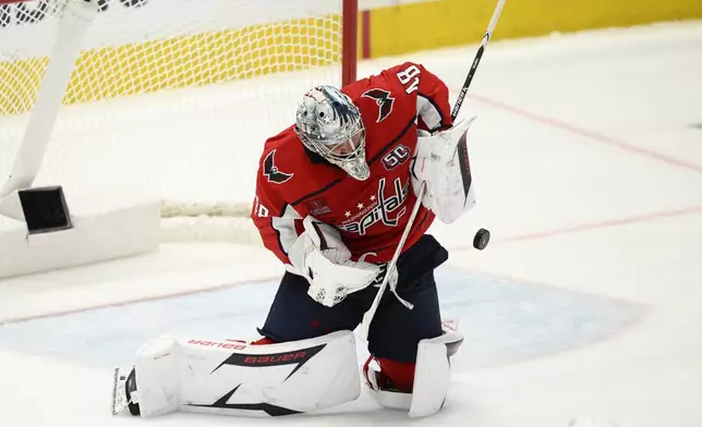 Washington Capitals goaltender Logan Thompson stops the puck in the third period of Game 1 of a first-round NHL hockey playoff series against the Montreal Canadiens, Monday, April 21, 2025, in Washington. (AP Photo/Nick Wass)
