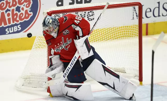 Washington Capitals goaltender Logan Thompson deflects the puck in the third period of Game 1 of a first-round NHL hockey playoff series against the Montreal Canadiens, Monday, April 21, 2025, in Washington. (AP Photo/Nick Wass)