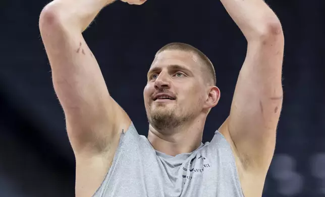 Denver Nuggets center Nikola Jokic warms up before an NBA basketball game against the Sacramento Kings, Wednesday, April 9, 2025, in Sacramento, Calif. (AP Photo/Sara Nevis)