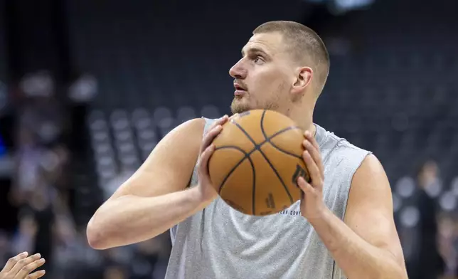 Denver Nuggets center Nikola Jokic warms up before an NBA basketball game against the Sacramento Kings, Wednesday, April 9, 2025, in Sacramento, Calif. (AP Photo/Sara Nevis)