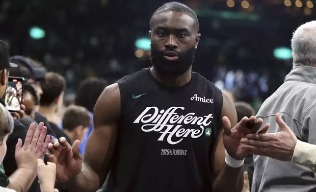Boston Celtics' Jaylen Brown leaves the court after defeating the Orlando Magic in game 1 of a first-round NBA playoff basketball series Sunday, April 20, 2025, in Boston. (AP Photo/Michael Dwyer)