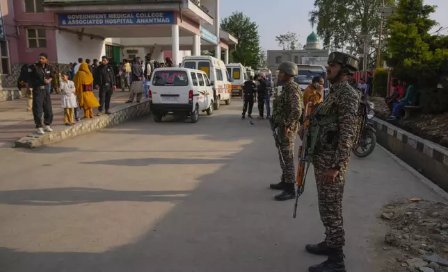 Indian security officers stands guard at a hospital in Anantnag after assailants indiscriminately fired at tourists visiting Pahalgam, Indian controlled Kashmir, Tuesday, April 22, 2025.(AP Photo/Dar Yasin)