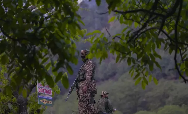 Indian security officers stand guard near Pahalgam in south Kashmir after assailants indiscriminately opened fired at tourists in Pahalgam, Indian controlled Kashmir, Tuesday, April 22, 2025. (AP Photo/Dar Yasin)