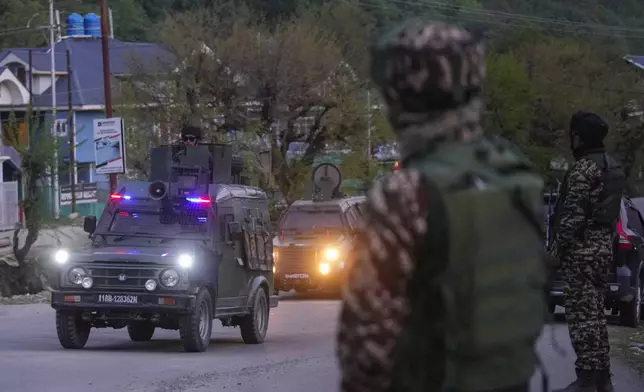 Indian security officers patrol in armored vehicles near Pahalgam in south Kashmir after assailants indiscriminately opened fired at tourists in Pahalgam, Indian controlled Kashmir, Tuesday, April 22, 2025. (AP Photo/Dar Yasin)
