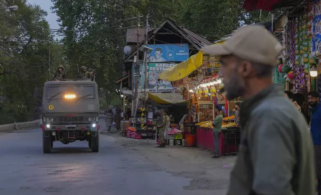 Indian security officers patrol in armored vehicle near Pahalgam in south Kashmir after assailants indiscriminately opened fired at tourists visiting Pahalgam, Indian controlled Kashmir, Tuesday, April 22, 2025.(AP Photo/Dar Yasin)