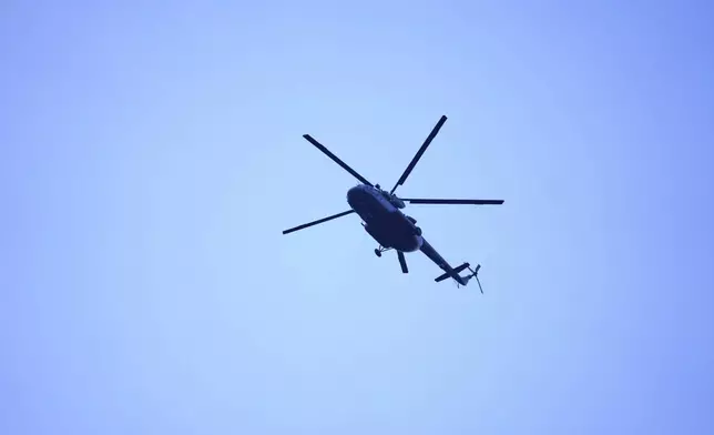 An Indian army helicopter patrols above Pahalgam a day after militants indiscriminately opened fire on tourists near the town, Indian controlled Kashmir, Wednesday, April 23, 2025. (AP Photo/Dar Yasin)