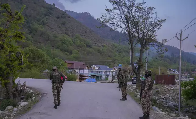 Indian security personnel stand guard in south Kashmir after assailants indiscriminately opened fired at tourists in Pahalgam, Indian controlled Kashmir, Tuesday, April 22, 2025. (AP Photo/Dar Yasin)