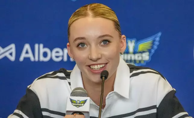 Dallas Wings' Paige Bueckers, selected No. 1 overall in the WNBA basketball draft, speaks during an introductory press conference Wednesday, April 23, 2025, in Dallas. (AP Photo/Julio Cortez)