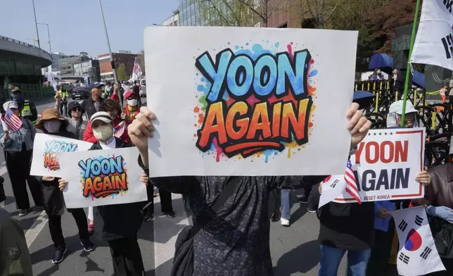 Supporters of recently ousted South Korean President Yoon Suk Yeol attend a rally to oppose his impeachment near the presidential residence in Seoul, South Korea, Friday, April 11, 2025. (AP Photo/Ahn Young-joon)