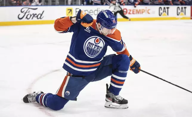 Edmonton Oilers' Corey Perry (90) celebrates a goal against the Los Angeles Kings during the second period of an NHL playoff game in Edmonton on Sunday, April 27, 2025. (Jason Franson/The Canadian Press via AP)
