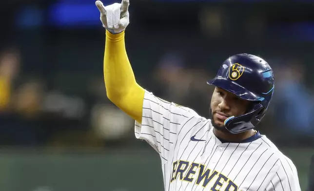 Milwaukee Brewers' Jackson Chourio reacts after his double against the Athletics during the second inning of a baseball game, Sunday, April 20, 2025, in Milwaukee. (AP Photo/Jeffrey Phelps)