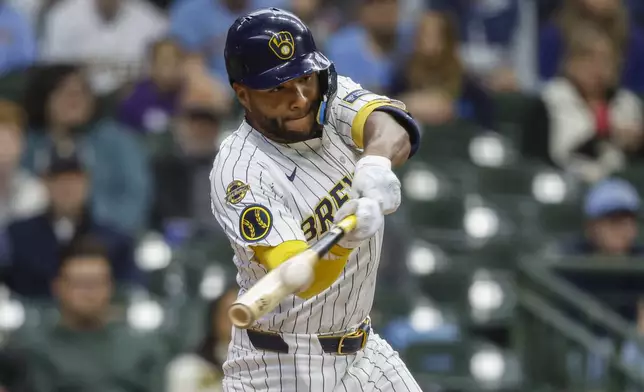 Milwaukee Brewers' Jackson Chourio hits a double against the Athletics during the second inning of a baseball game, Sunday, April 20, 2025, in Milwaukee. (AP Photo/Jeffrey Phelps)