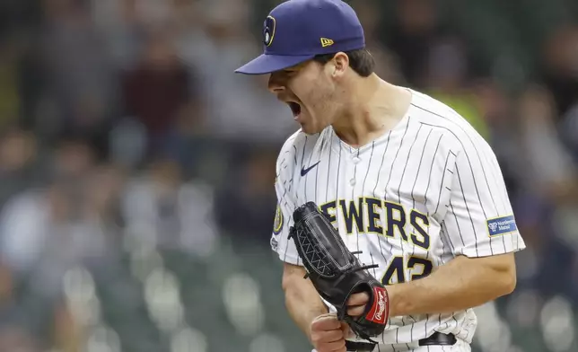 Milwaukee Brewers starting pitcher Logan Henderson reacts after striking out the Athletics' Tyler Soderstrom during the sixth inning of a baseball game, Sunday, April 20, 2025, in Milwaukee. (AP Photo/Jeffrey Phelps)