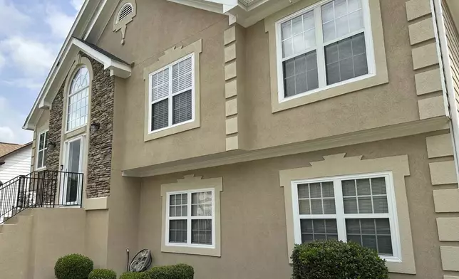 The Atlanta home where Trina Martin, her then-boyfriend Toi Cliatt and her 7-year-old son were living when the FBI broke down the door and stormed in, is seen on Friday, April 25, 2025. (AP Photo/Sudhin Thanawala)