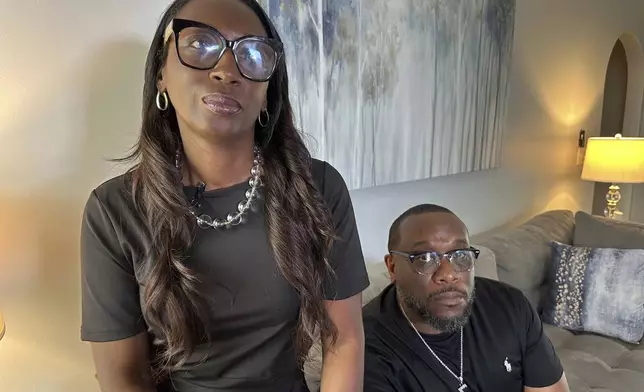 Trina Martin, left, and Toi Cliatt sit for a portrait inside the home the FBI mistakenly raided in 2017, in Atlanta on Friday, April 25, 2025. (AP Photo/Sudhin Thanawala)