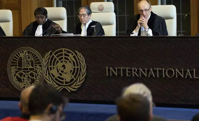 Presiding judge Yuji Iwasawa opens the International Court of Justice hearings into a United Nations request for an advisory opinion on Israel's obligations to allow humanitarian assistance in Gaza and the West Bank, in The Hague, Netherlands, Monday, April 28, 2025. (AP Photo/Peter Dejong)