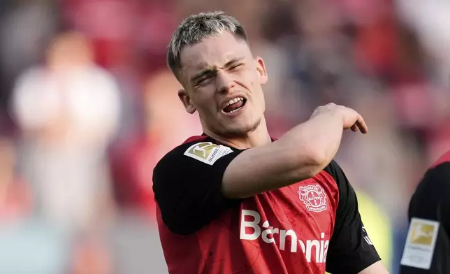 Leverkusen's Florian Wirtz reacts disappointed during the German Bundesliga soccer match between Bayer Leverkusen and Union Berlin at the BayArena in Leverkusen, Germany, Saturday, April 12, 2025. (AP Photo/Martin Meissner)