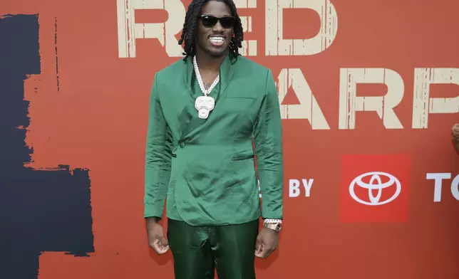 Texas A&amp;M defensive lineman Shemar Stewart poses on the carpet before the first round of the NFL football draft, Thursday, April 24, 2025, in Green Bay, Wis. (AP Photo/Matt Ludtke)
