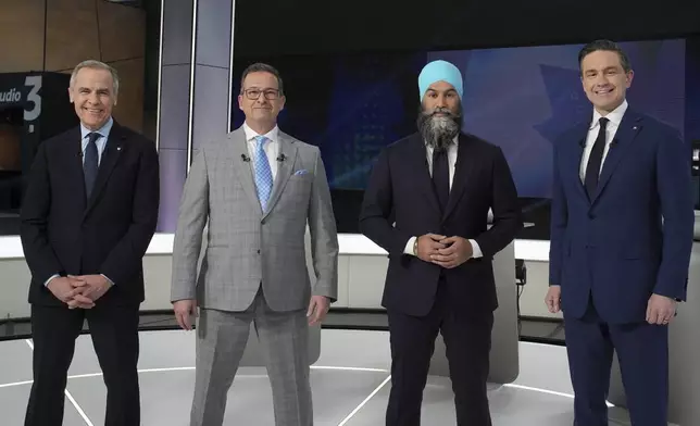 From left to rigt, Liberal leader Mark Carney, Bloc Quebecois Leader Yves-Francois Blanchet, New Democratic Party Leader Jagmeet Singh and Conservative Leader Pierre Poilievre pose for a photo before the French-language federal leaders' debate, in Montreal, Wednesday, April 16, 2025. (Christopher Katsarov/The Canadian Press via AP)