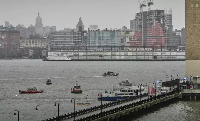 First responders from New Jersey and New York respond to the scene where a helicopter crashed in the Hudson River, Thursday, April 10, 2025, in Jersey City, N.J. (AP Photo/Seth Wenig)