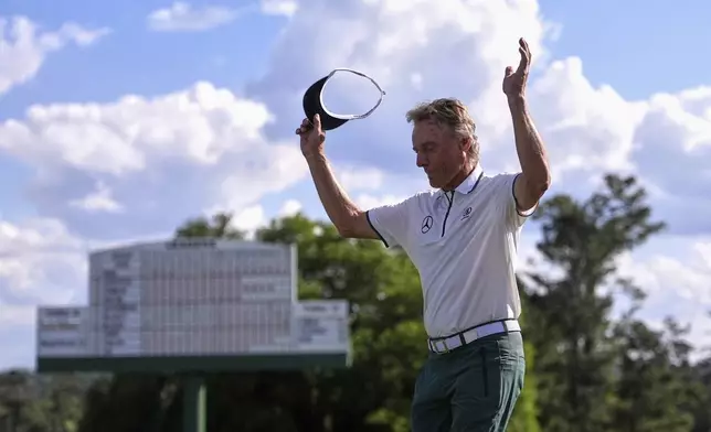 Bernhard Langer, of Germany, waves to the gallery after the second round at the Masters golf tournament, Friday, April 11, 2025, in Augusta, Ga. (AP Photo/George Walker IV)