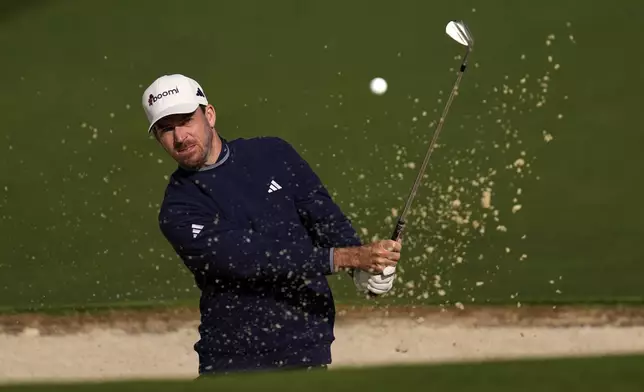Nick Taylor, of Canada, hits from the bunker on the second hole during the second round at the Masters golf tournament, Friday, April 11, 2025, in Augusta, Ga. (AP Photo/Ashley Landis)