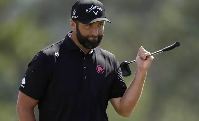 Jon Rahm, of Spain, waves after making a putt on the 18th hole during the second round at the Masters golf tournament, Friday, April 11, 2025, in Augusta, Ga. (AP Photo/George Walker IV)