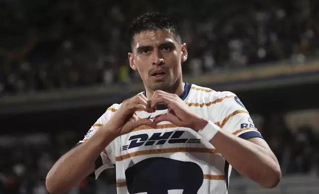Guillermo Martinez of Mexico's Pumas celebrates scoring his side's first goal against Canada's Vancouver Whitecaps during a CONCACAF Champions Cup second leg quarterfinal soccer match in Mexico City, Wednesday, April 9, 2025. (AP Photo/Eduardo Verdugo)