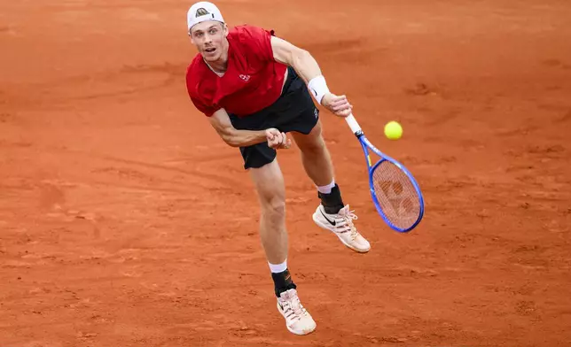 Canada's Denis Shapovalov serves to Germany's Diego Germany's Dedura-Palomero during the first round of the Munich tennis tournament, in Munich, Germany, Tuesday, April, 15, 2025. (Tom Weller/dpa via AP)