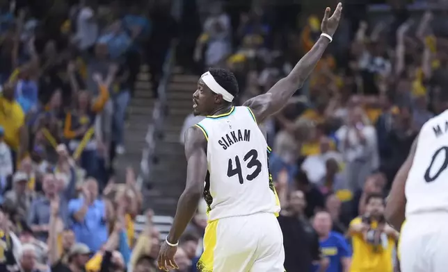 Indiana Pacers forward Pascal Siakam (43) celebrates after a basket against the Milwaukee Bucks during the second half of a first-round NBA basketball playoff game in Indianapolis, Tuesday, April 22, 2025. (AP Photo/Michael Conroy)