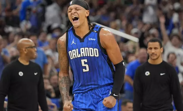 Orlando Magic forward Paolo Banchero celebrates a 3-point shot against the Boston Celtics during the first half in game 3 of a first-round NBA playoff basketball series,, Friday, April 25, 2025, in Orlando, Fla. (AP Photo/John Raoux)