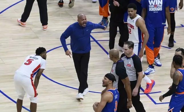 Detroit Pistons head coach J.B. Bickerstaff, center, tries to argue a non-call after the New York Knicks won Game 4 of an NBA basketball first-round playoff series in Detroit, Sunday, April 27, 2025. (David Guralnick/Detroit News via AP)
