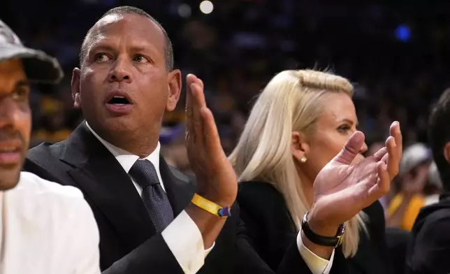 Alex Rodriguez, co-owner, of the Minnesota Timberwolves, claps during the second half in Game 1 of an NBA first-round playoff series Los Angeles Lakers, Saturday, April 19, 2025, in Los Angeles. (AP Photo/Mark J. Terrill)