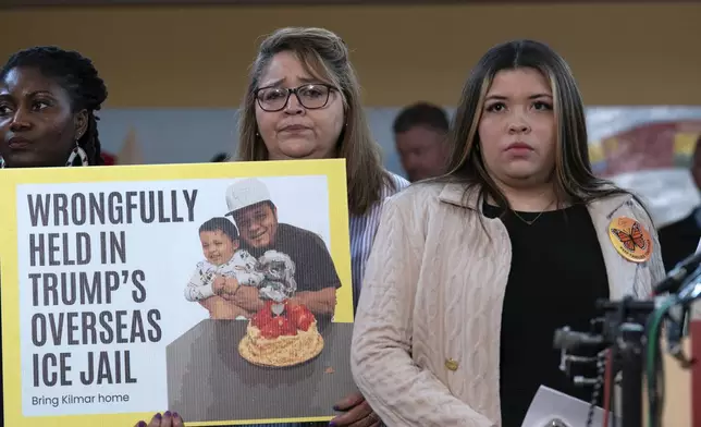 Jennifer Vasquez Sura, the wife of Kilmar Abrego Garcia of Maryland, who was mistakenly deported to El Salvador, right, stands with supporters during a news conference at CASA's Multicultural Center in Hyattsville, Md., Friday, April 4, 2025. (AP Photo/Jose Luis Magana)