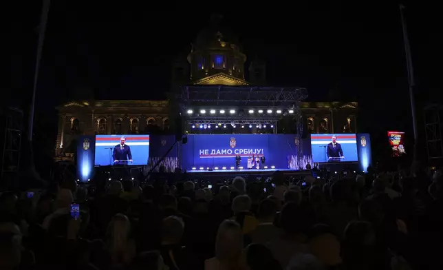 Serbia's President Aleksandar Vucic speaks to his supporters gathered during a huge rally in his support, apparently designed to counter student-led gatherings in Belgrade, Serbia, Saturday, April 12, 2025. (AP Photo/Darko Vojinovic)