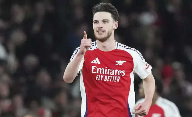 Arsenal's Declan Rice celebrates after scoring his side's second goal during the Champions League quarterfinal first leg soccer match between Arsenal and Real Madrid at the Emirates Stadium in London, Tuesday, April 8, 2025. (AP Photo/Frank Augstein)