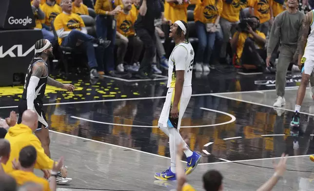 Indiana Pacers' Myles Turner celebrates after making a 3-point basket during the second half of a first-round NBA basketball playoff game against the Milwaukee Bucks, Saturday, April 19, 2025, in Indianapolis. (AP Photo/Michael Conroy)