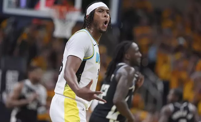 Indiana Pacers' Myles Turner celebrates after making a 3-point basket during the second half of a first-round NBA basketball playoff game against the Milwaukee Bucks, Saturday, April 19, 2025, in Indianapolis. (AP Photo/Michael Conroy)