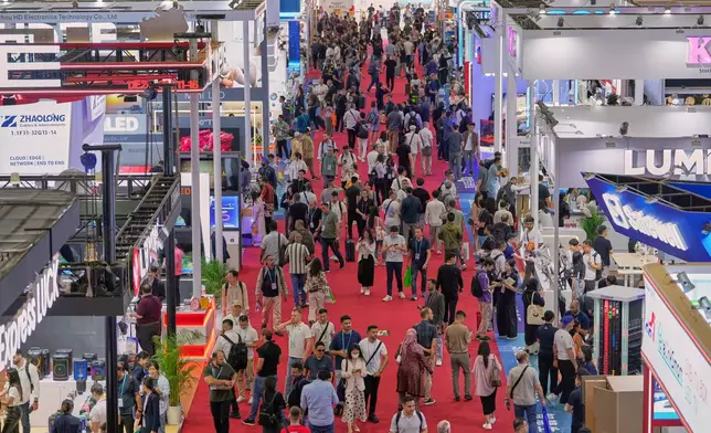 Visitors are seen at the 137th Canton Fair in Guangzhou, southern China's Guangdong province on Tuesday, April 15, 2025. (AP Photo/Ng Han Guan)